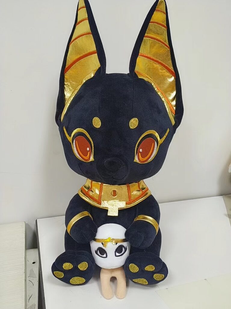 Close-up detail of high-precision embroidery on custom plush toys, strict QC standard.